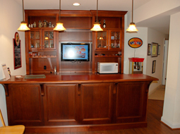 Custom Maple Bar and cabinets with TV installed